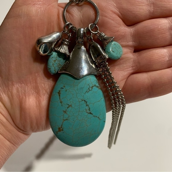 Silver tone and turquoise necklace with oversized pendant and charms. - Picture 5 of 8